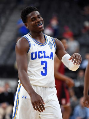 UCLA Bruins guard Aaron Holiday (3) celebrates after the UCLA Bruins defeated the Stanford Cardinal in a quarterfinal match in the Pac-12 Tournament at T-Mobile Arena.