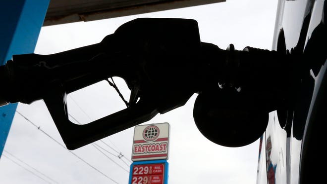 Gas is pumped into a car at the Eastcoast filling station Thursday, Dec. 18, 2014, in Pennsauken N.J.