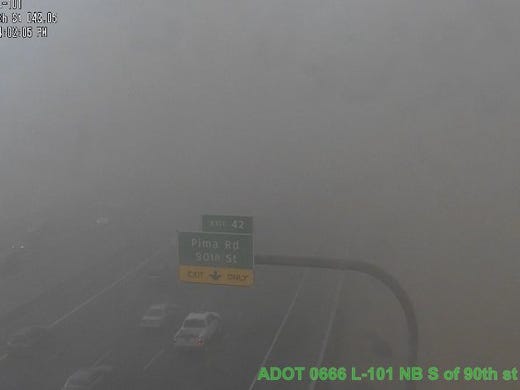 A wall of dust blanketed Loop 101 at 90th Street in