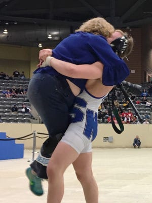 SK senior Casey Cornett hugs his mother, Angie Lewis, after winning his second state championship.
