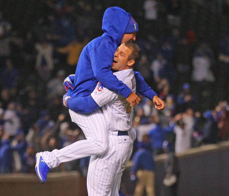 Chicago Cubs first baseman Anthony Rizzo (44) celebrates with center fielder Albert Almora Jr. (5) after hitting the game-winning single during the ninth inning against the Los Angeles Dodgers at Wrigley Field.