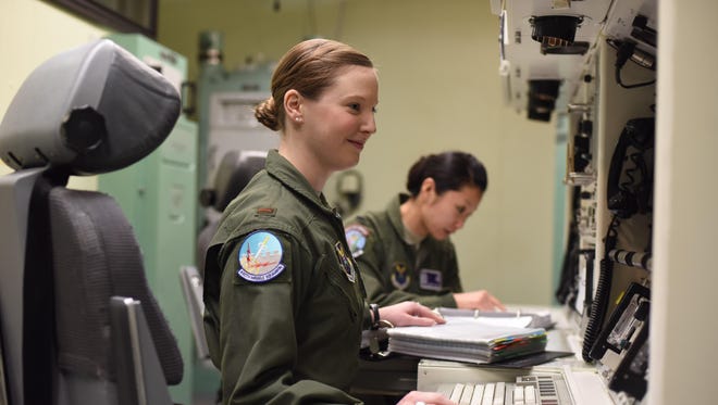 Second Lt. Alexandra Rea, left, and 1st Lt. Elizabeth Guidara in the missile procedures trainer at Malmstrom Air Force Base on Monday.