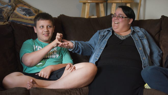 Jamison and his mom Jessica Fox talk about Jamison's autism and how they work with him as a family in their home Monday, Aug. 7, in Sioux Falls.