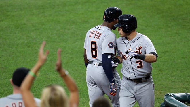 Ian Kinsler of the Detroit Tigers celebrates with Justin Upton after hitting a first inning solo home run.