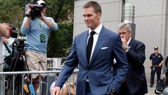 Tom Brady, who didn't have to serve a four-game suspension over DeflateGate last season, when this photo was taken, now faces that punishment.