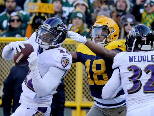 Baltimore Ravens cornerback Jimmy Smith intercepts
