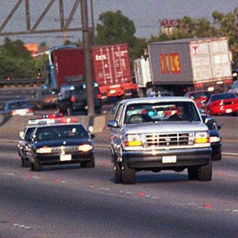 On June 17, 1994, Law enforcement vehicles keep a 