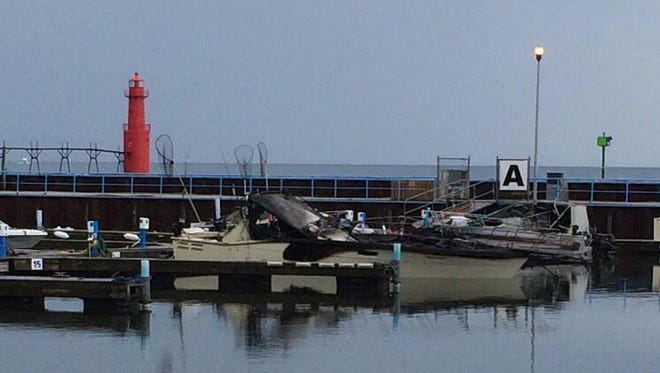 Damaged boats sit in Algoma Marina the morning of June 23 after an overnight recreational boat fire caused damage to five boats, three of which later sank. Sunrise Cove Marina is hosting a Blessing of the Fleet ceremony in Algoma on June 22.