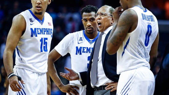 Memphis head coach Tubby Smith (second right) during a break in action against Northern Kentucky at the FedExForum in Memphis Tenn., Saturday, November 25, 2017.