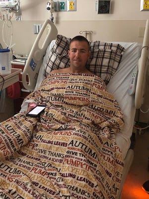 Greater Naples Fire Rescue District firefighter Doug Holden, who needs another kidney transplant, in the hospital.