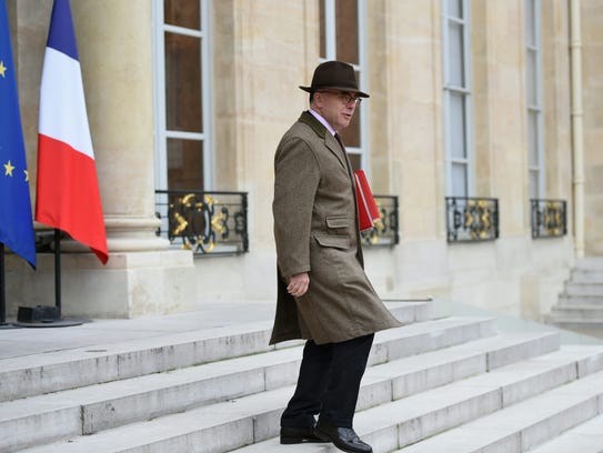 French Interior Minister Bernard Cazaneuve leaves after