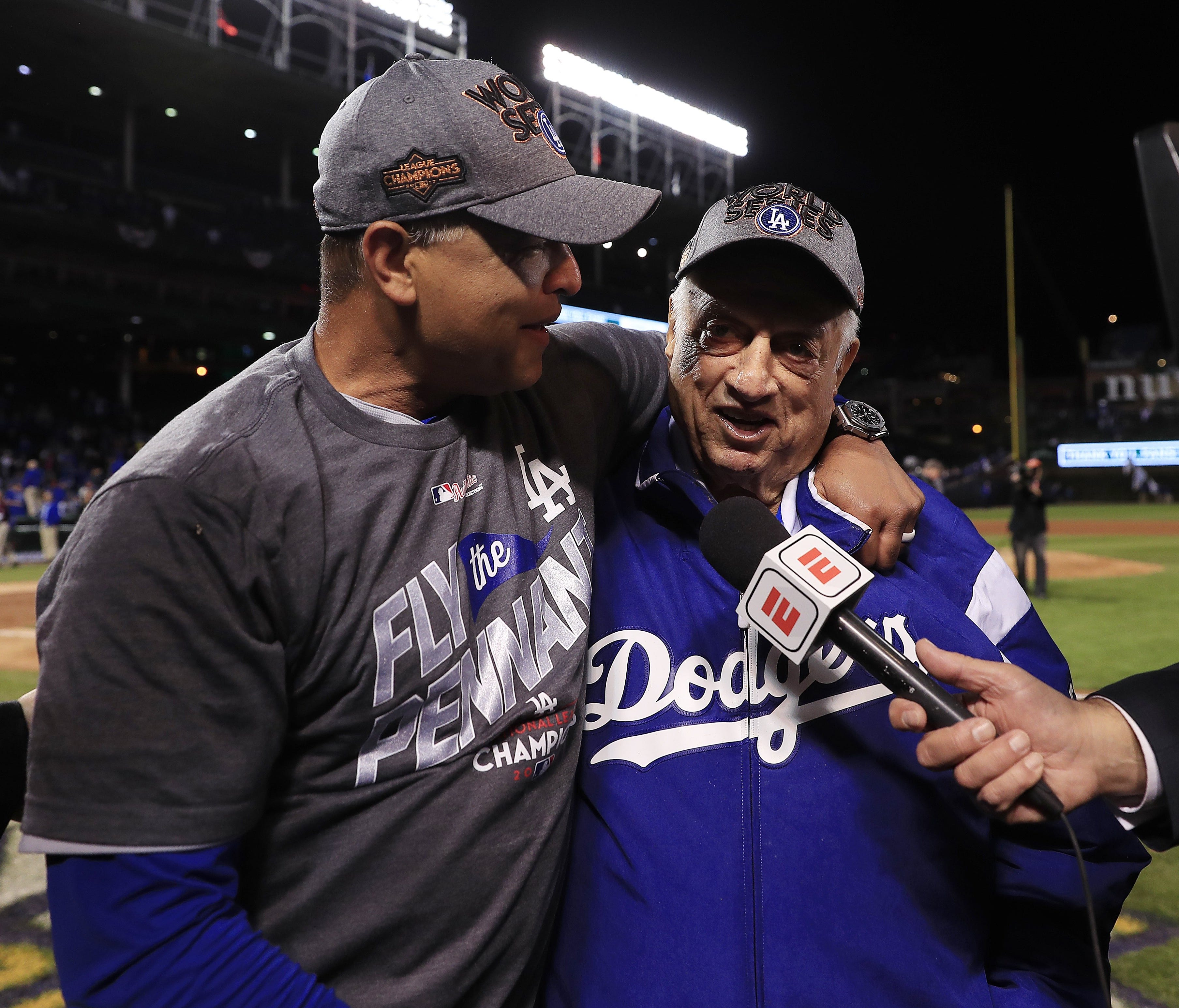 Dodgers manager Dave roberts with former manager Tommy Lasorda after NLCS.