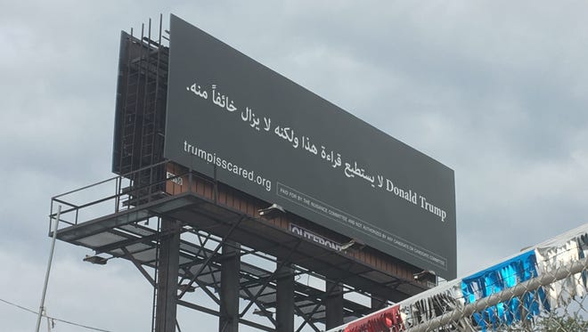 A billboard on westbound I-94 entering Dearborn translates to "Donald Trump, he can't read this, but he is afraid of it" and was posted by the Nuisance Committee Super PAC.