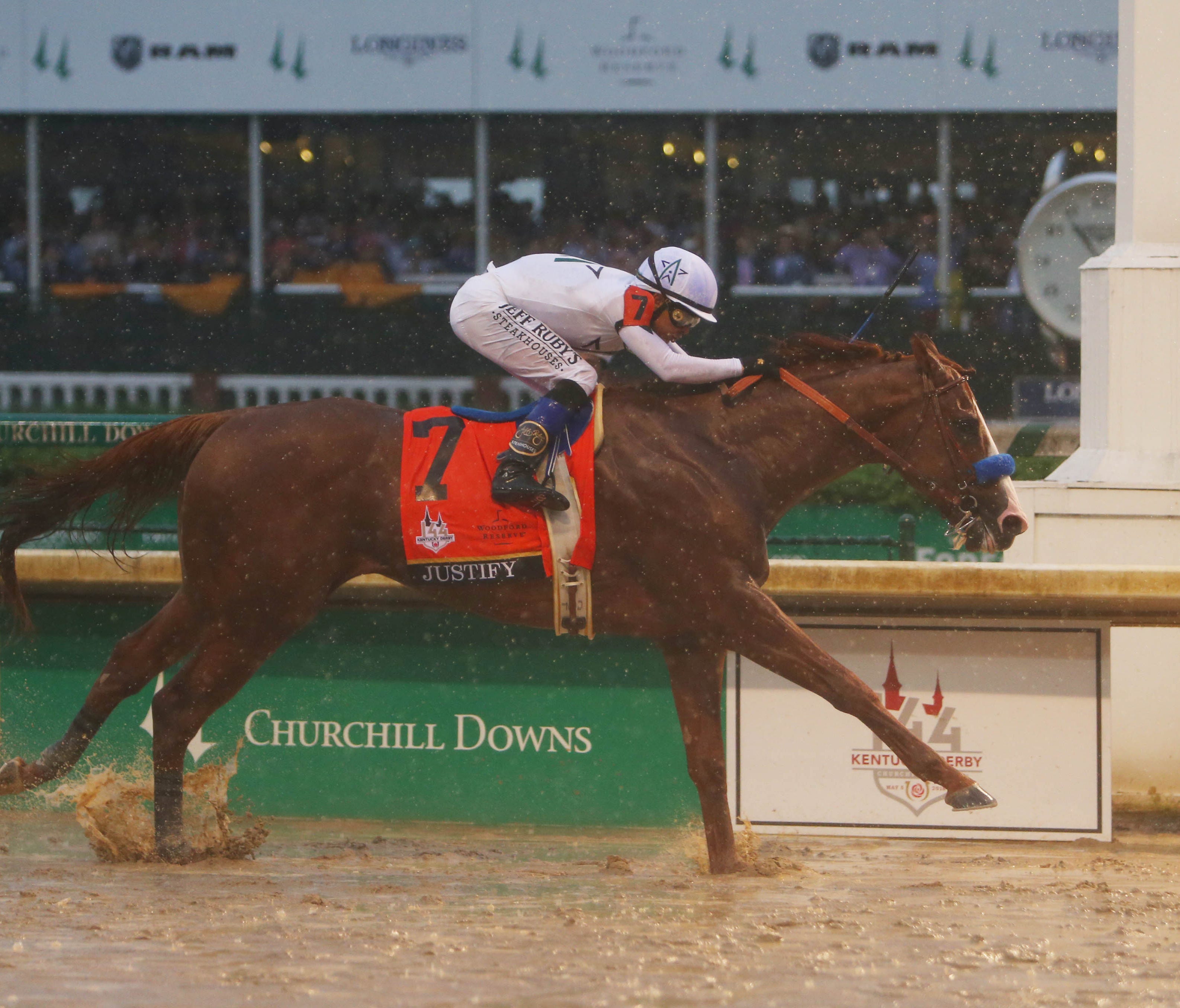 Mike Smith aboard Justify (7) crosses the finish line to win the 144th running of the Kentucky Derby at Churchill Downs.