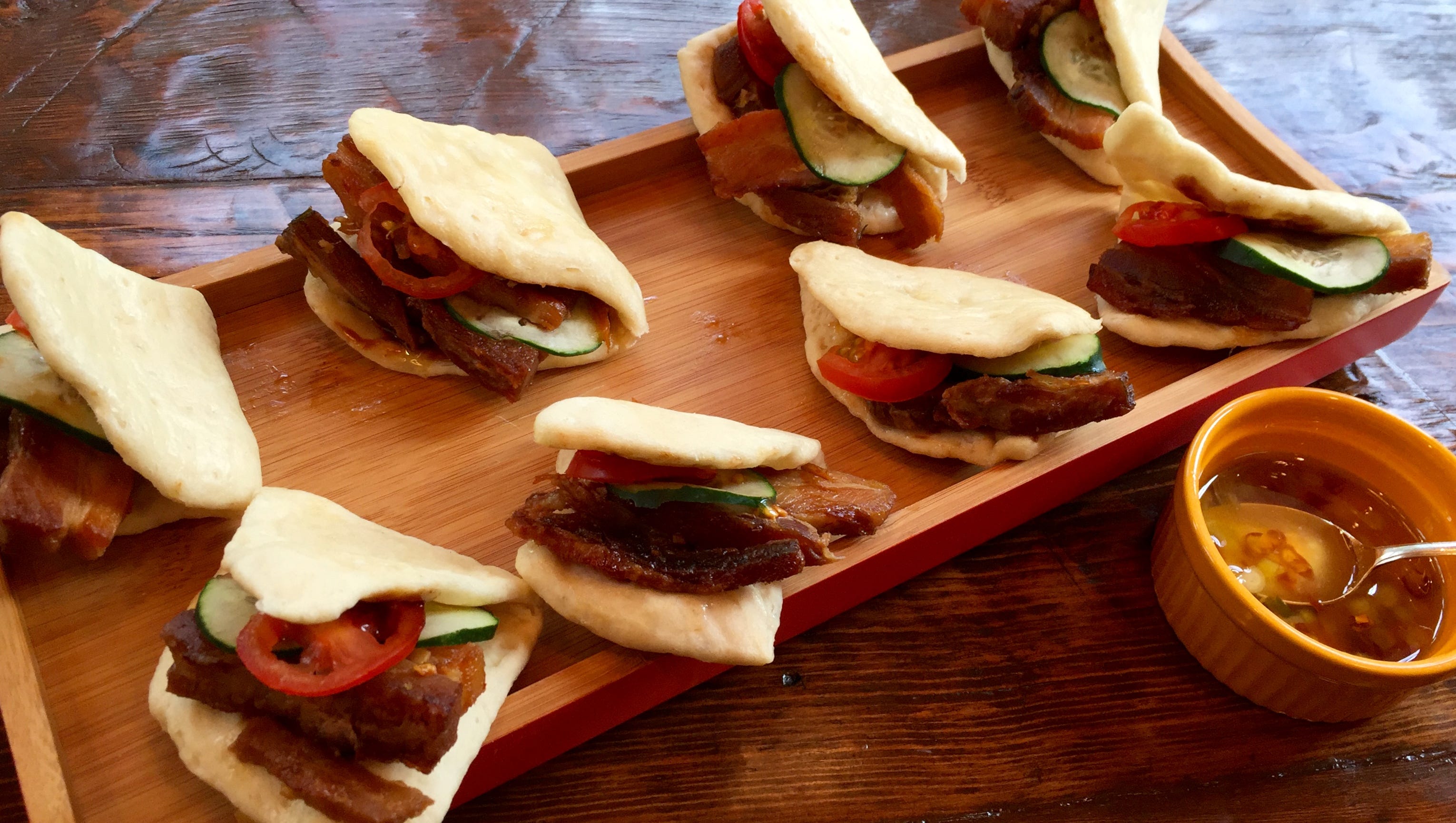 Spicy Pork on Steamed Buns with Tomato and Cucumber Slices