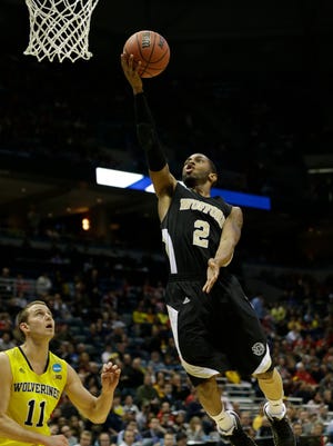 Wofford Terriers guard Karl Cochran (2) lays the ball up during the second round of the 2014 NCAA Tournament against the Michigan Wolverines at BMO Harris Bradley Center.