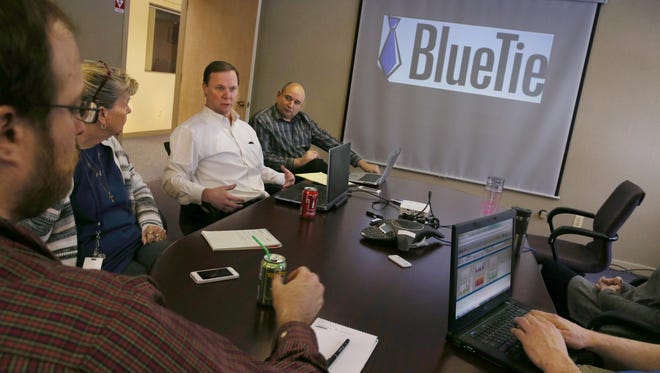 BlueTie President and CEO Robert Doty, third from left, leads a weekly staff meeting updating the group on current projects at Blue Tie offices in Penfield Wednesday, Jan. 20, 2016. Pictured from left are John Crosier, software engineering manager, Maureen Piles, human resources manager, Doty and Marvin Deitz, chief marketing officer.