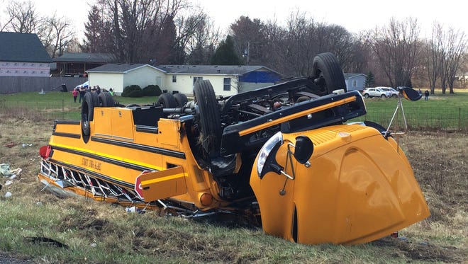 A school bus carrying Griffith High boys basketball team is seen overturned in Demotte, Ind., Saturday, March 19, 2016. The bus rolled over on Interstate 65 on the way to Saturday's semifinal game against Marion at Lafayette Jefferson.
