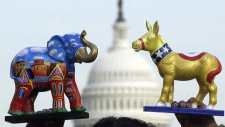 Painted tabletop models of the Republican elephant and the Democratic donkey,
