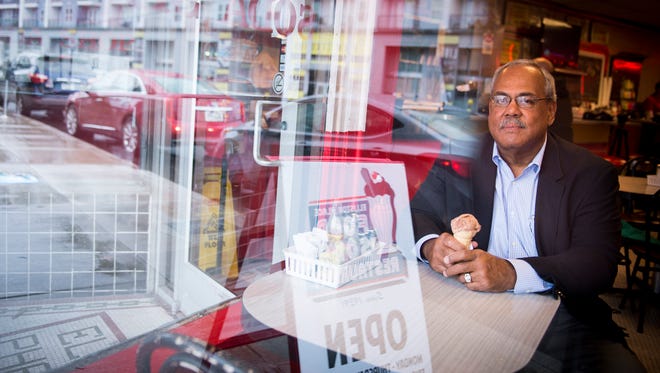 Howard Gentry Jr. sits inside Elliston Place Soda Shop, the place that wouldn't serve him ice cream in 1960 because of his race.