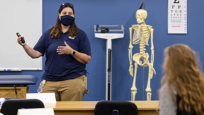 Professor Celest Weuve, the director of the Masters of Athletic Training program, discuss how to to deal with an athlete that has had a separated shoulder in a masters class for athletic training on the first day of classes at the University of Illinois Springfield, Monday, August 24, 2020, in Springfield, Ill.