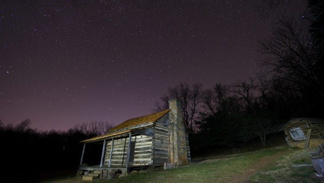 A long exposure photo of a replica log cabin at the Humpback Rocks Visitor Center, Blue Ridge Parkway,  on Dec. 5, 2015, near Waynesboro.