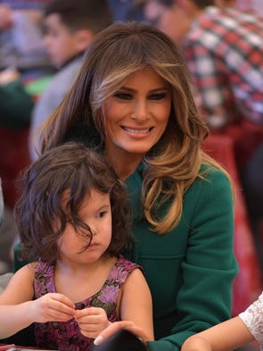 First lady Melania Trump got cozy with cute kiddies,