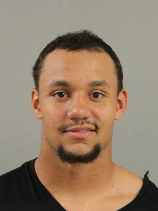 UM football player charged with sexual assault in East Lansing