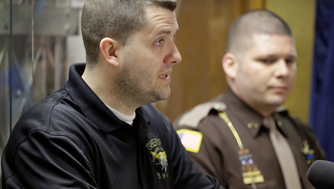 Howard County Sheriff  Sgt. Jordan Buckley, in black shirt,  the deputy who was injured in the shooting that took the life of deputy Carl Koontz, gave a statement Tuesday, Mar 22, 2016, at the Howard County Sheriff's department in Kokomo IN.