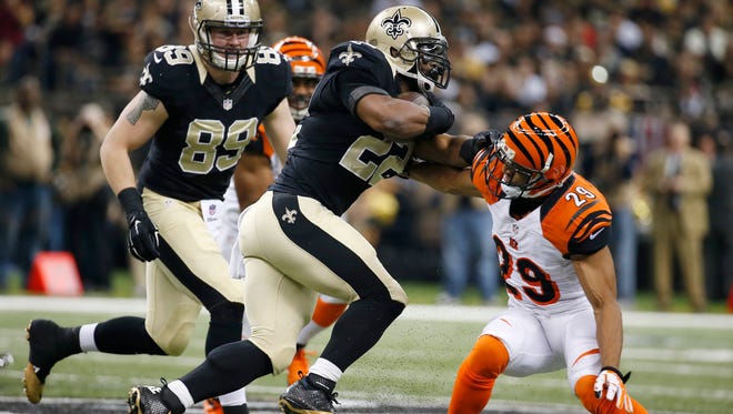 Bengals cornerback Leon Hall makes a tackle against the Saints on Sunday.