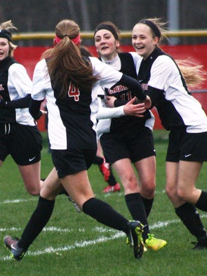 Churchill sophomore Alexis Staff (second from right) is congratulated by teammates after scoring the only goal in Thursday’s 1-0 victory over Canton.