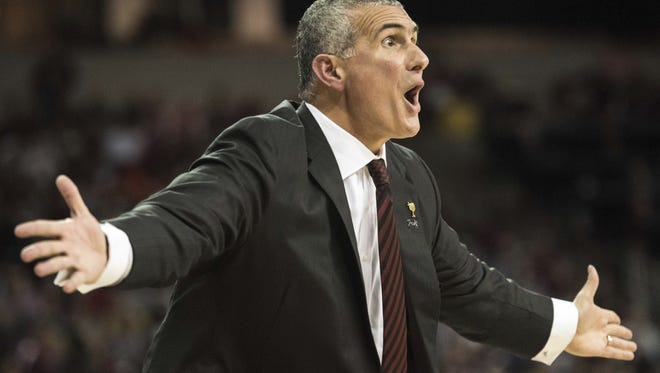 South Carolina head coach Frank Martin communicates with a player during the first half of an NCAA college basketball game against Clemson, Wednesday, Dec. 21, 2016.
