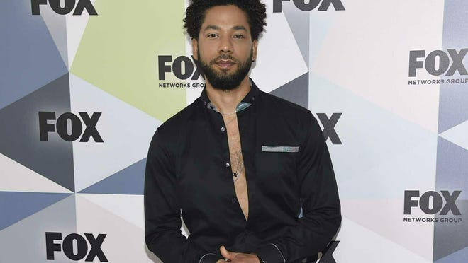 FILE - In this May 14, 2018 file photo, Jussie Smollett, a cast member in the TV series "Empire," attends the Fox Networks Group 2018 programming presentation afterparty in New York. A police official says "Empire" actor is now considered a suspect "for filing a false police report" and that detectives are presenting the case against him to a grand jury. Smollett told police he was attacked by two masked men while walking home from a Subway sandwich shop at around 2 a.m. on Jan. 29. He says they beat him, hurled racist and homophobic insults at him and looped a rope around his neck before fleeing. (Photo by Evan Agostini/Invision/AP, File)