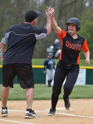Middletown North's Christine Gebhardt is congratulated after hitting a home run in the first inning. Middletown North vs Middletown South softball.Middletown, NJ Thursday, April 28, 2016@DhoodHood