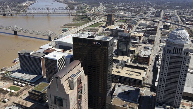 Michael Clevenger/The Courier-Journal
Some of the challenges facing Louisville are inequality, heat, pollution and flooding. 
Downtown Louisville and the Louisville skyline. showing the Ohio River, Clark Memorial Bridge,  Kennedy Bridge and the Big Four Bridge. April 4, 2015