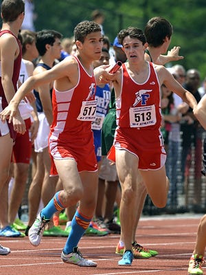 Fairport's Ben Bulkeley, right, won a boys invitational indoor mile race last Saturday during the New Balance Games at the Armory in the Bronx.