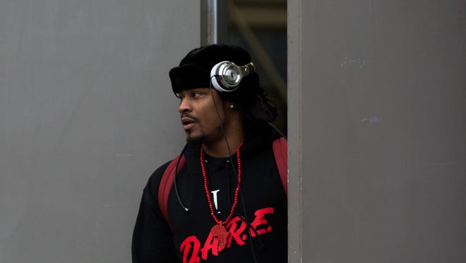 Seattle Seahawks running back Marshawn Lynch leaves the Virginia Mason Athletic Center to board a bus to travel to the team's NFL football game Sunday against the Carolina Panthers, Friday, Jan. 15, 2016, in Seattle.