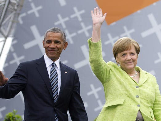 Obama and German Chancellor Angela Merkel arrive for