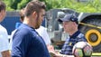 Michigan offensive lineman Jon Runyan dribbles a ball