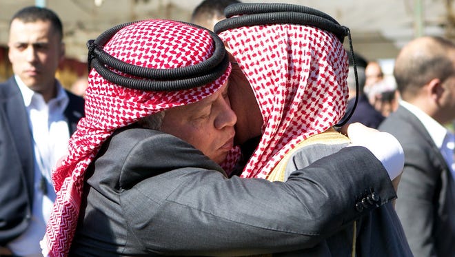 Jordanian King Abdullah II, left, greets Safi, the father of Jordanian pilot Muath al-Kaseasbeh, who was burned alive by Islamic State militants, on Feb. 5 in Karak.