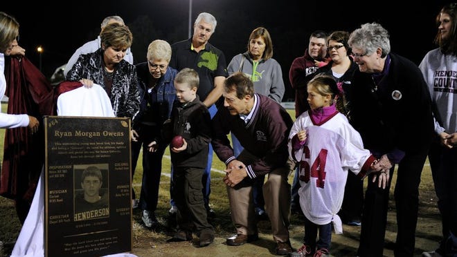 In 2013, Ryan Owens' family takes their first look at the plaque honoring him that was unveiled by then-HCHS principal Sally Sugg, second from left, and then-athletic director Vivian Tomblin, left, during halftime of the Colonels' game against Marshall County. Ryan passed away at the age of 16 while he was a student and athlete at Henderson County High School.