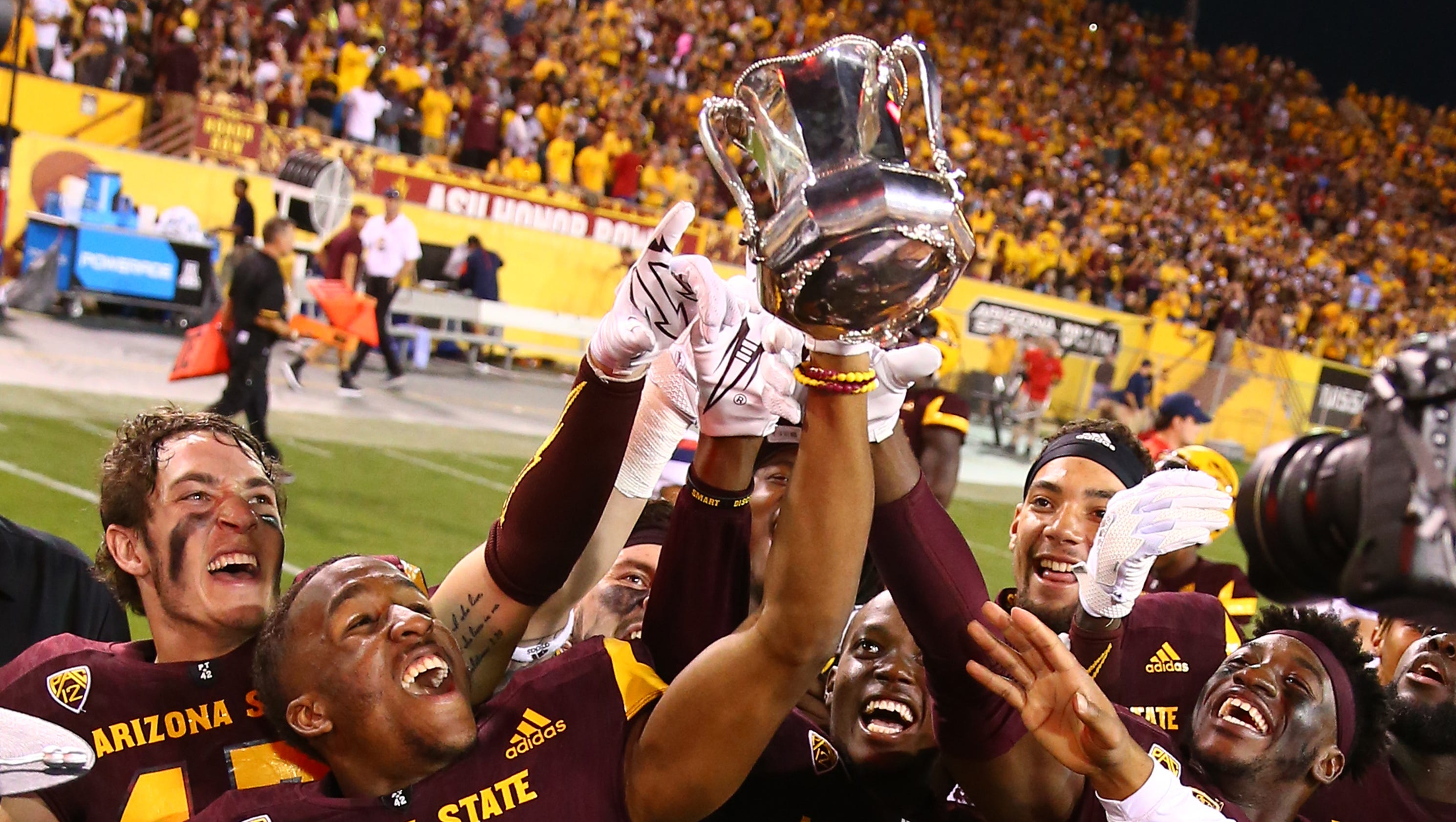 2017 college football rivalry trophies