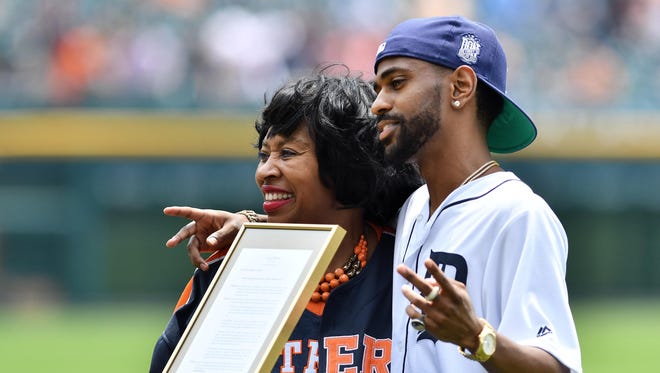 Big Sean, right, with Detroit City Council President Brenda Jones before he throws out the ceremonial first pitch before the Detroit Tigers-Kansas City Royals game Thursday at Comerica Park in Detroit.