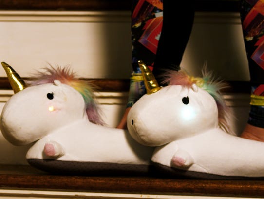 Adorable unicorn slippers ($39.99) for any lady in