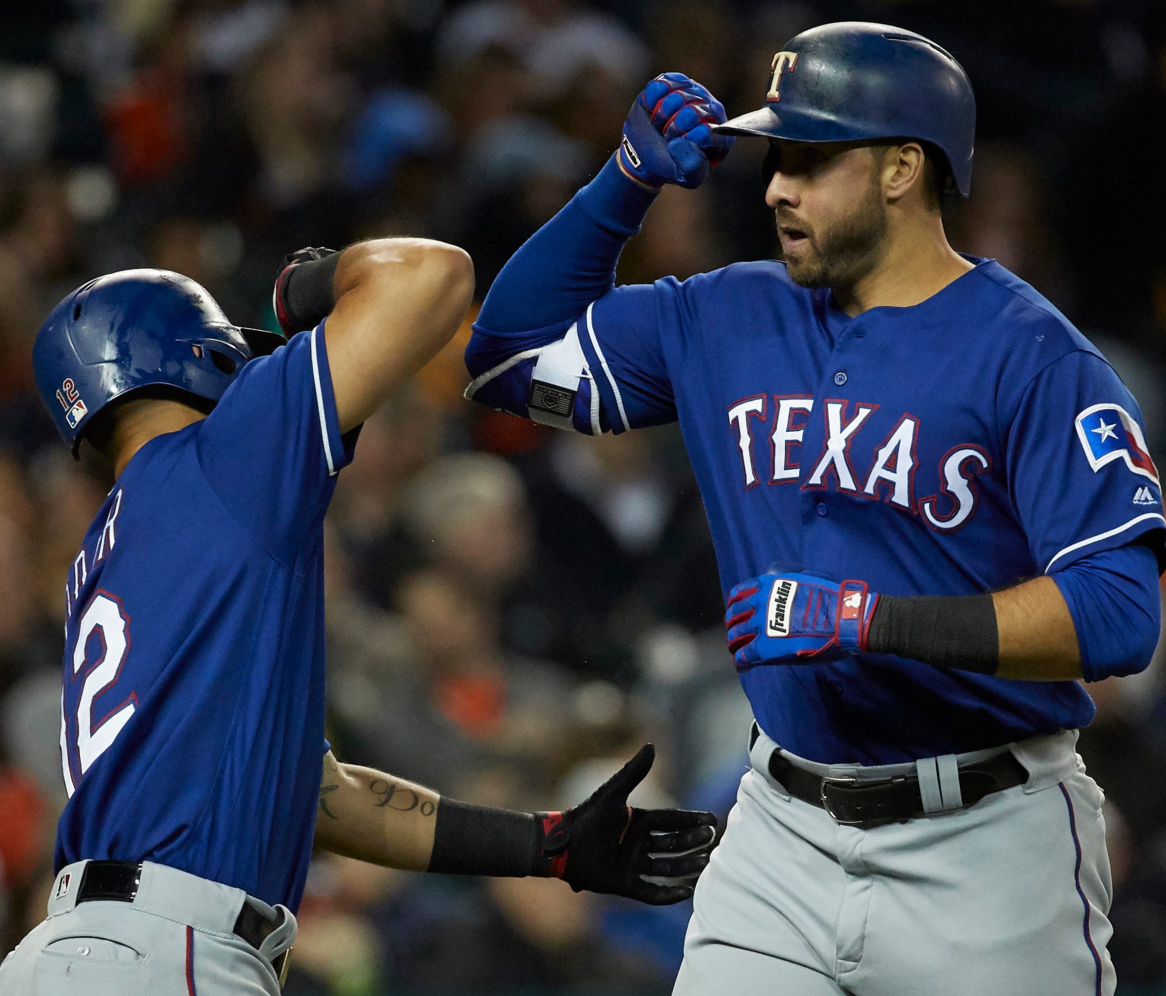 Joey Gallo (right) celebrates with  Rougned Odor after hitting a two-run home run in the sixth inning against the Detroit Tigers.