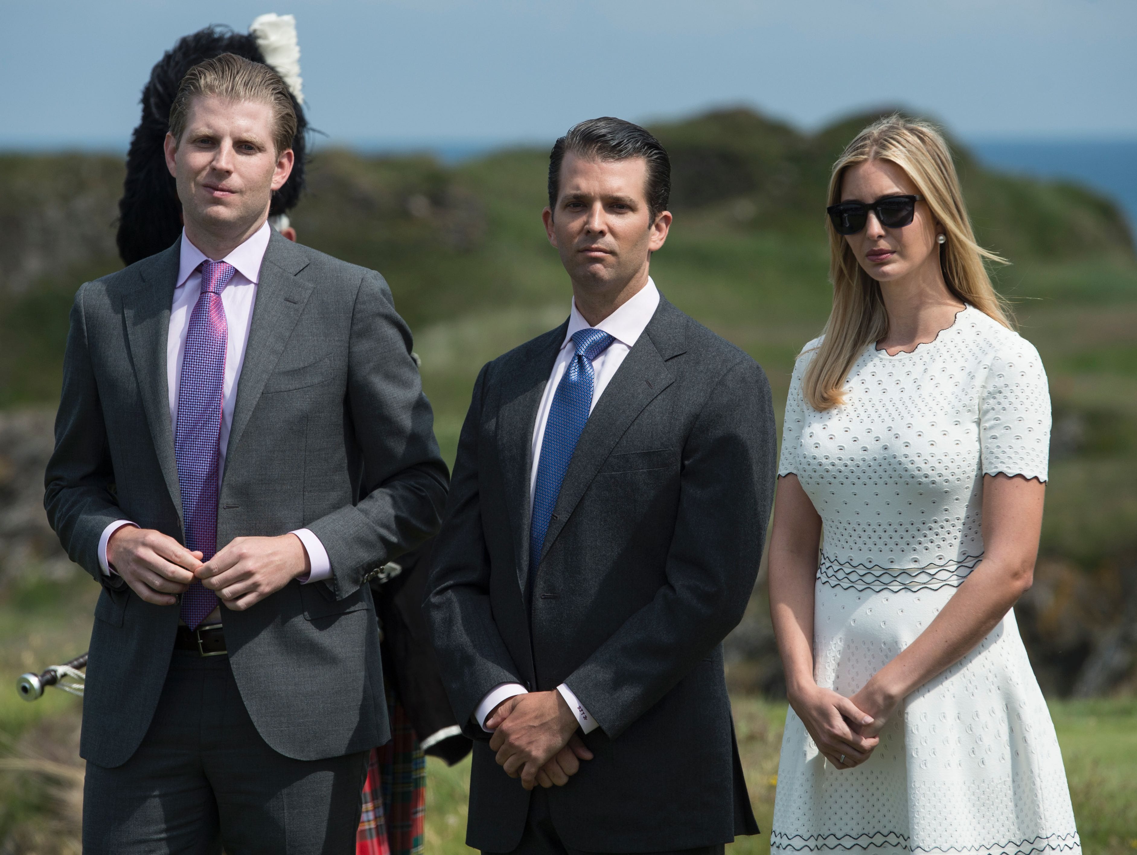 This file photo shows the children of Republican presidential-elect Donald Trump, Ivanka Trump (R), Donald Trump Jr. (C) and Eric Trump (L)  at the official opening of Trump Turnberry Hotel and Golf Resort in Turnberry, Scotland.