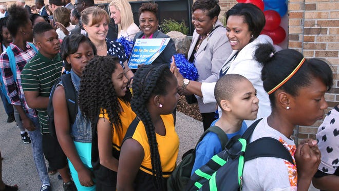 Superintendent Darienne Driver greets students at Sherman Multicultural Arts School on the first day of classes in 2016.