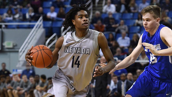Nevada's Lindsey Drew drives past Air Force's Jacob Van during their game in Reno last season. The team will match up Wednesday at Lawlor Events Center.