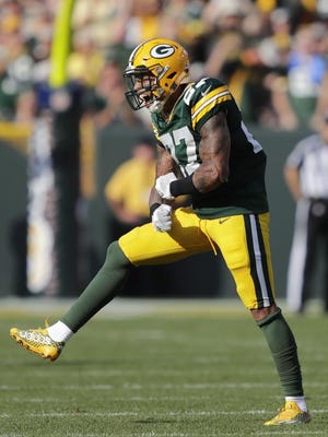 Green Bay Packers safety Josh Jones (27) celebrates a sack against Cincinnati Bengals quarterback Andy Dalton (14) Sunday, September 24, 2017, at Lambeau Field in Green Bay, Wis.