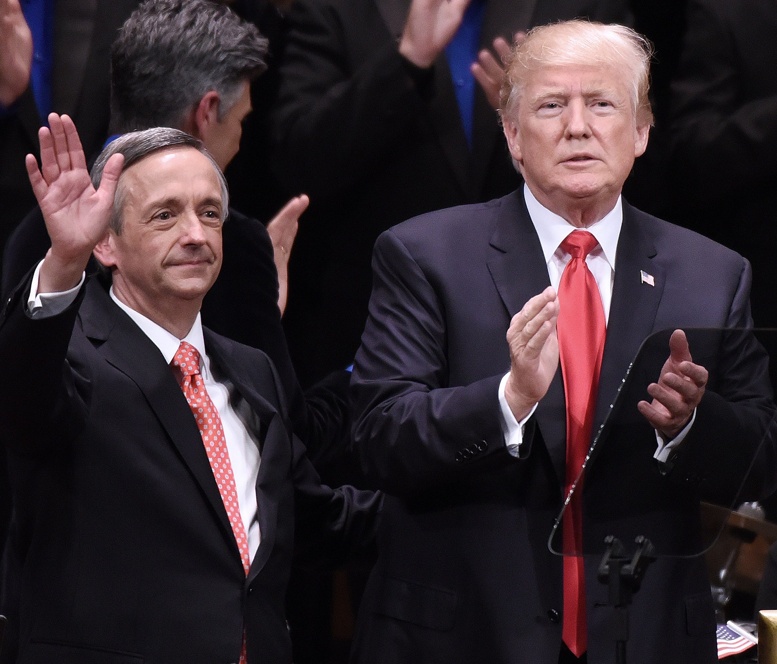 President Trump (right) and past Robert Jeffress (left) are pictured participating in the Celebrate Freedom Rally at the John F. Kennedy Center for the Performing Arts in Washington.